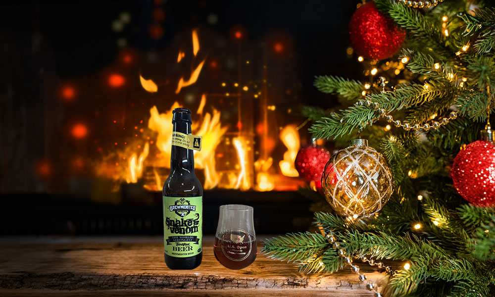 A cozy Christmas scene featuring a decorated tree with red and gold and with Snake Venom, #1 of the world's most alcoholic beers. . 